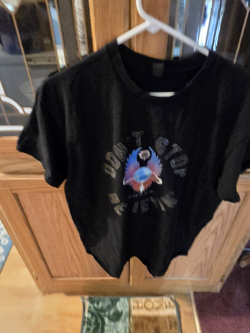 Black Graphic Tee with Colorful Winged Planet Design